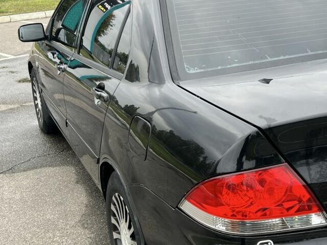 Черный Мицубиси Лансер, объемом двигателя 1.6 л и пробегом 390 тыс. км за 4000 $, фото 6 на Automoto.ua