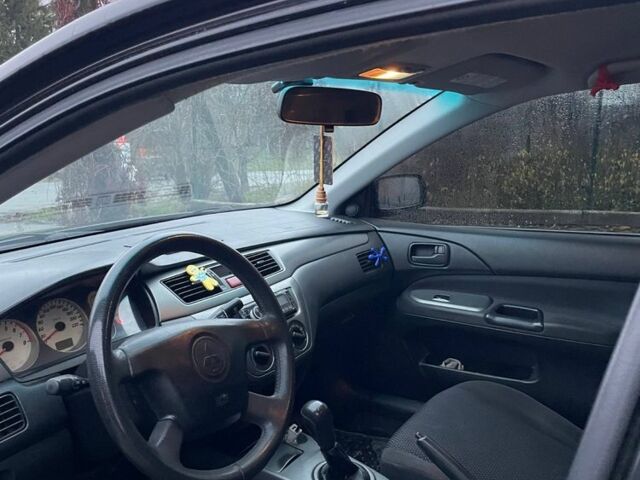 Черный Мицубиси Лансер, объемом двигателя 1.6 л и пробегом 240 тыс. км за 3499 $, фото 6 на Automoto.ua