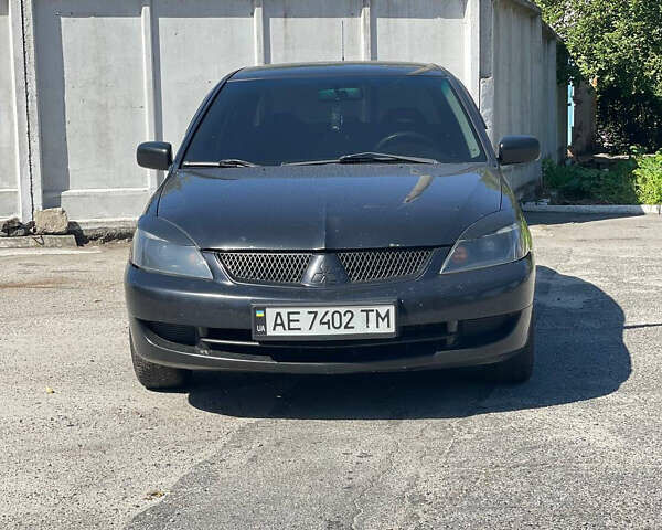 Чорний Міцубісі Lancer, об'ємом двигуна 1.58 л та пробігом 320 тис. км за 3600 $, фото 1 на Automoto.ua