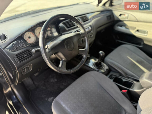 Чорний Міцубісі Lancer, об'ємом двигуна 1.6 л та пробігом 205 тис. км за 3650 $, фото 7 на Automoto.ua