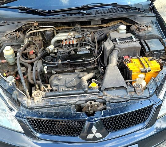 Чорний Міцубісі Lancer, об'ємом двигуна 1.6 л та пробігом 0 тис. км за 4100 $, фото 4 на Automoto.ua