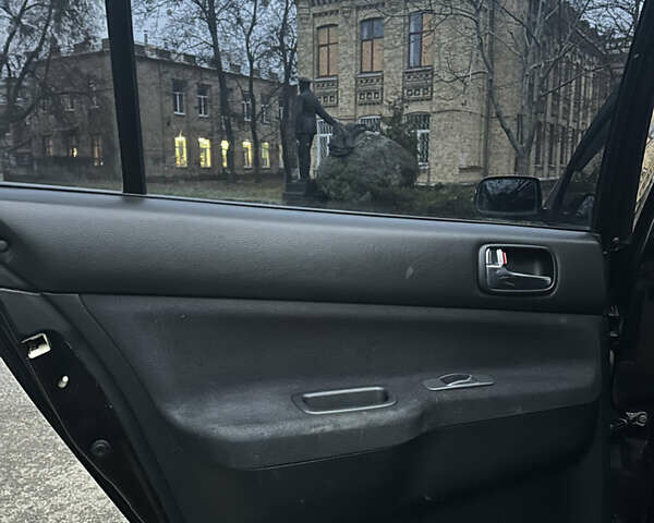 Чорний Міцубісі Lancer, об'ємом двигуна 2 л та пробігом 250 тис. км за 3999 $, фото 12 на Automoto.ua