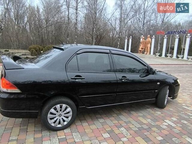 Чорний Міцубісі Lancer, об'ємом двигуна 1.58 л та пробігом 263 тис. км за 4500 $, фото 4 на Automoto.ua