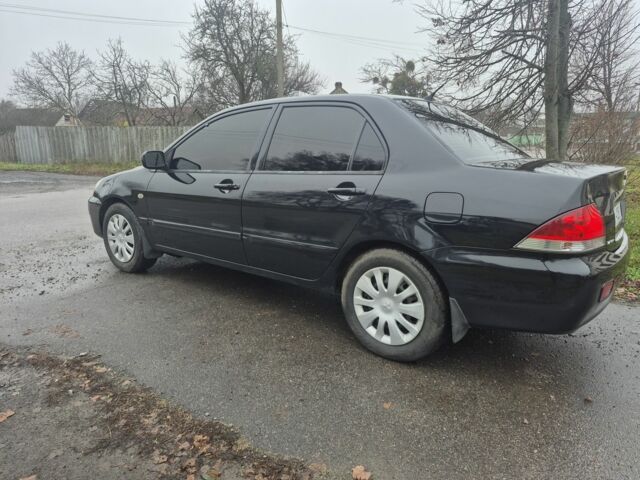 Черный Мицубиси Лансер, объемом двигателя 1.6 л и пробегом 280 тыс. км за 3200 $, фото 2 на Automoto.ua