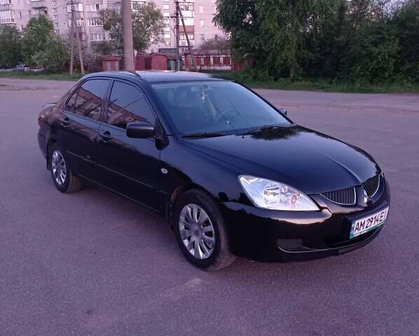 Чорний Міцубісі Lancer, об'ємом двигуна 1.58 л та пробігом 210 тис. км за 4900 $, фото 3 на Automoto.ua