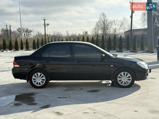 Чорний Міцубісі Lancer, об'ємом двигуна 1.6 л та пробігом 205 тис. км за 3650 $, фото 4 на Automoto.ua