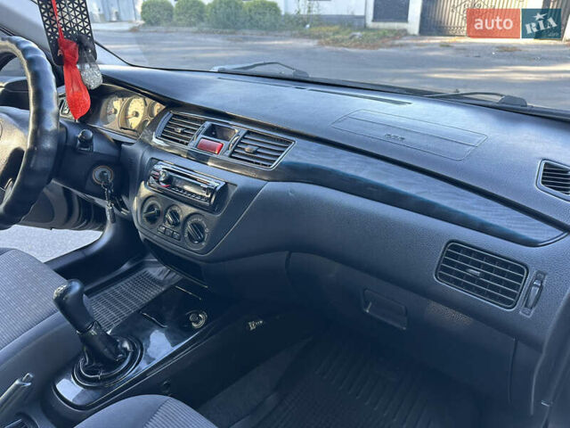 Мицубиси Лансер 2005 в Виннице на Automoto.ua Черный Мицубиси Лансер, объемом двигателя 1.6 л и пробегом 261 тыс. км за 4100 $, фото 52 на Automoto.ua