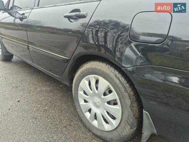 Черный Мицубиси Лансер, объемом двигателя 1.58 л и пробегом 280 тыс. км за 3200 $, фото 8 на Automoto.ua
