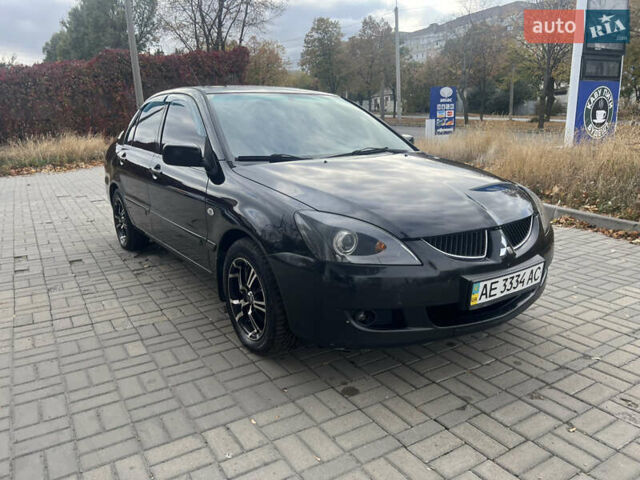 Чорний Міцубісі Lancer, об'ємом двигуна 1.58 л та пробігом 364 тис. км за 4000 $, фото 4 на Automoto.ua