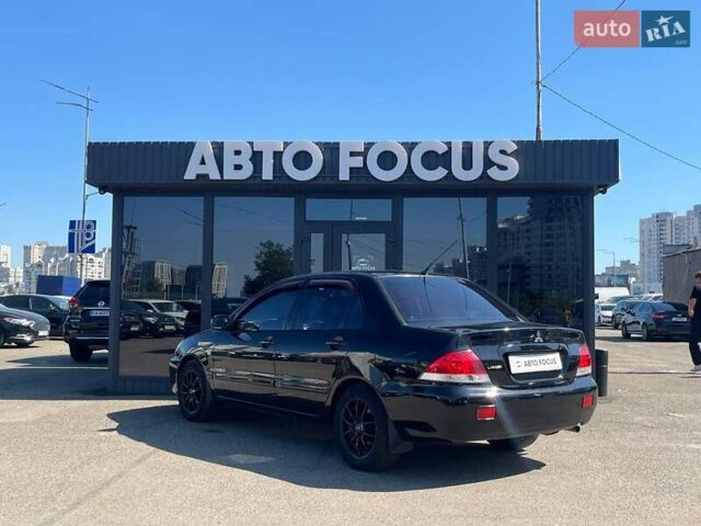 Черный Мицубиси Лансер, объемом двигателя 1.58 л и пробегом 310 тыс. км за 5690 $, фото 4 на Automoto.ua