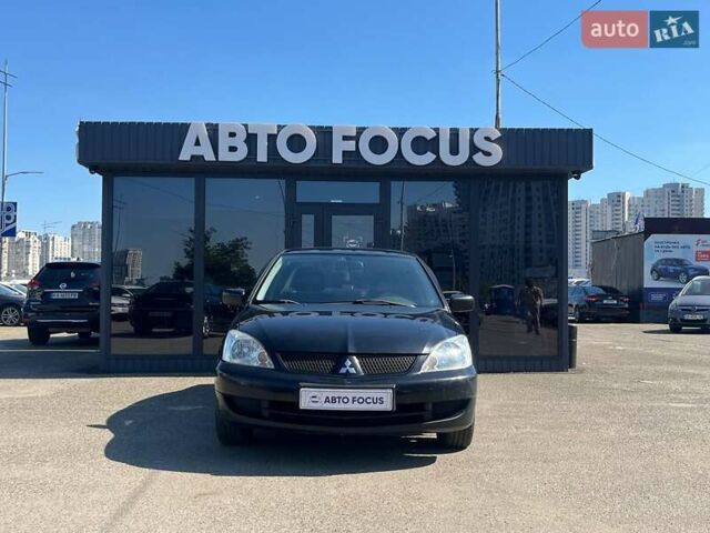 Черный Мицубиси Лансер, объемом двигателя 1.58 л и пробегом 310 тыс. км за 5690 $, фото 2 на Automoto.ua