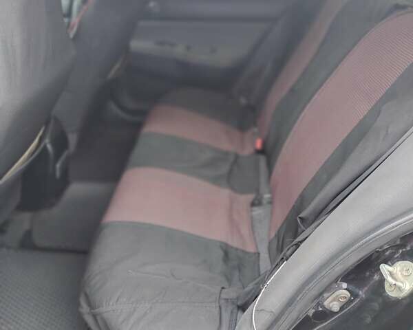 Міцубісі Lancer 2005 у Запоріжжя на Automoto.ua Чорний Міцубісі Lancer, об'ємом двигуна 1.58 л та пробігом 186 тис. км за 4700 $, фото 5 на Automoto.ua