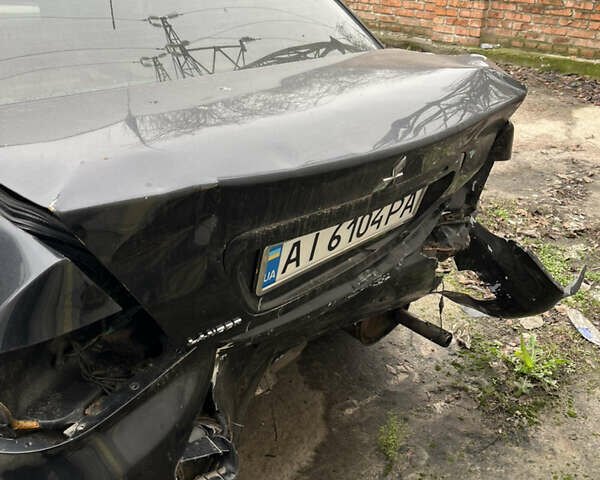 Чорний Міцубісі Lancer, об'ємом двигуна 1.58 л та пробігом 360 тис. км за 1500 $, фото 5 на Automoto.ua