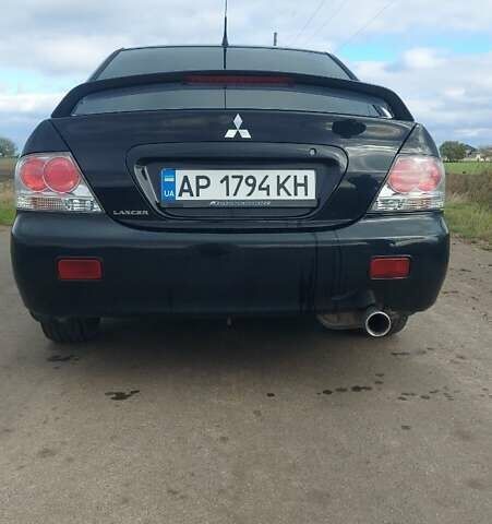 Черный Мицубиси Лансер, объемом двигателя 2 л и пробегом 225 тыс. км за 4400 $, фото 5 на Automoto.ua