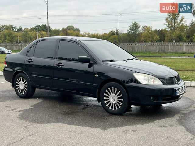 Чорний Міцубісі Lancer, об'ємом двигуна 1.58 л та пробігом 390 тис. км за 4500 $, фото 7 на Automoto.ua