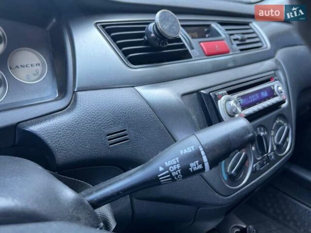 Черный Мицубиси Лансер, объемом двигателя 1.58 л и пробегом 310 тыс. км за 5690 $, фото 20 на Automoto.ua