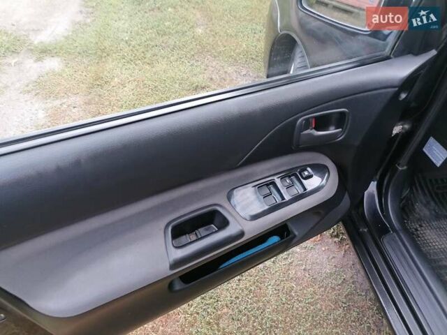 Чорний Міцубісі Lancer, об'ємом двигуна 1.58 л та пробігом 210 тис. км за 2999 $, фото 12 на Automoto.ua