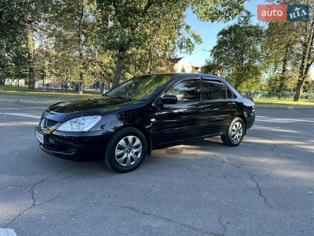 Мицубиси Лансер 2005 в Виннице на Automoto.ua Черный Мицубиси Лансер, объемом двигателя 1.6 л и пробегом 261 тыс. км за 4100 $, фото 28 на Automoto.ua