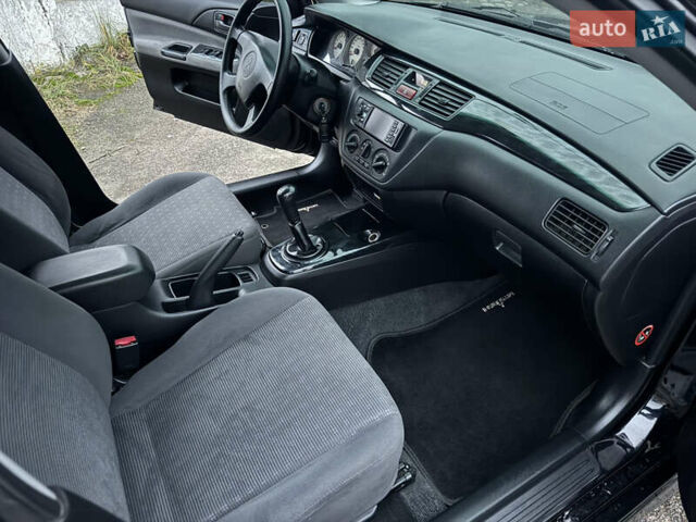 Черный Мицубиси Лансер, объемом двигателя 1.58 л и пробегом 154 тыс. км за 5500 $, фото 35 на Automoto.ua