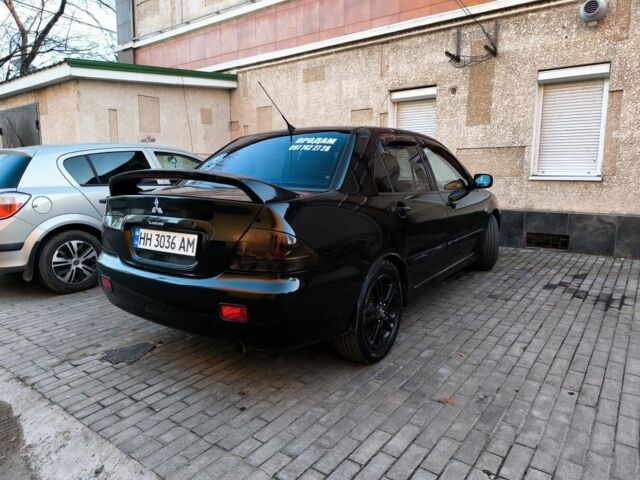 Чорний Міцубісі Lancer, об'ємом двигуна 2 л та пробігом 261 тис. км за 2700 $, фото 3 на Automoto.ua