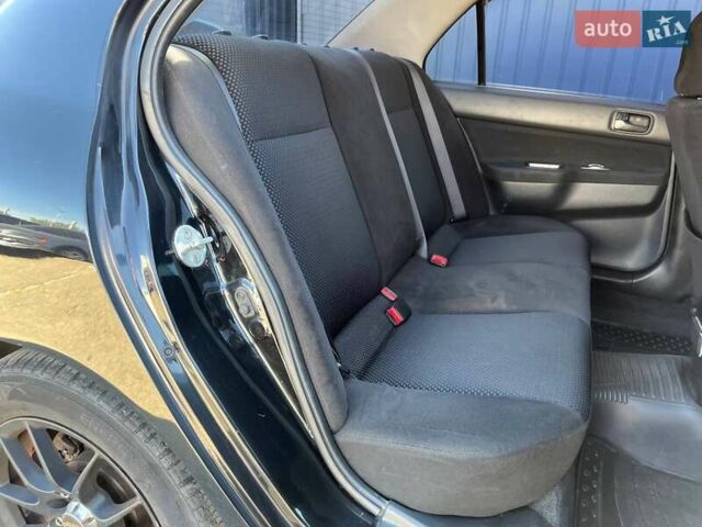 Черный Мицубиси Лансер, объемом двигателя 1.58 л и пробегом 310 тыс. км за 5690 $, фото 10 на Automoto.ua