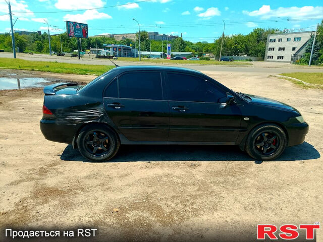 Черный Мицубиси Лансер, объемом двигателя 1.6 л и пробегом 230 тыс. км за 2650 $, фото 5 на Automoto.ua