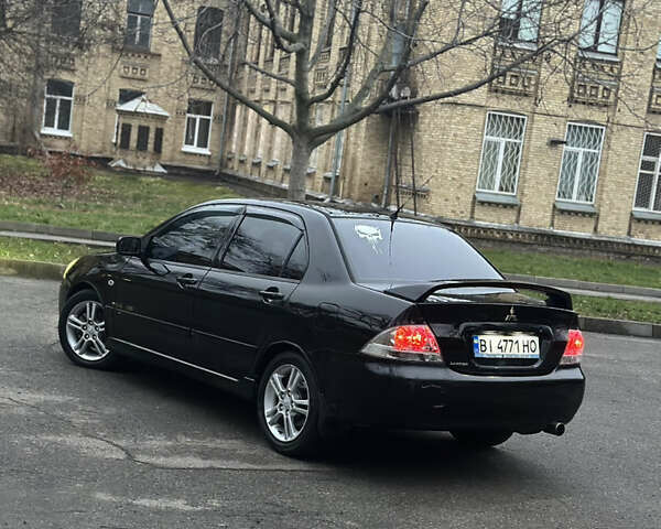 Черный Мицубиси Лансер, объемом двигателя 2 л и пробегом 250 тыс. км за 3700 $, фото 10 на Automoto.ua