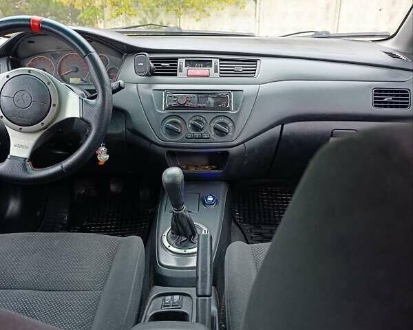 Черный Мицубиси Лансер, объемом двигателя 2 л и пробегом 225 тыс. км за 4400 $, фото 10 на Automoto.ua