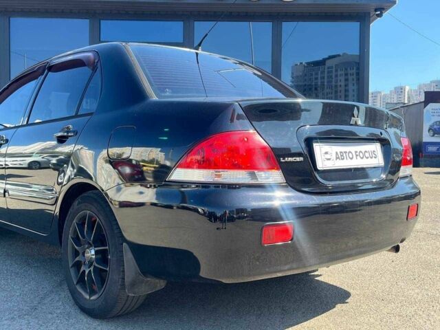 Чорний Міцубісі Lancer, об'ємом двигуна 2 л та пробігом 310 тис. км за 4990 $, фото 5 на Automoto.ua