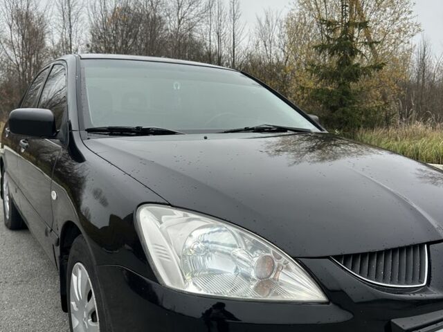 Черный Мицубиси Лансер, объемом двигателя 1.6 л и пробегом 200 тыс. км за 3500 $, фото 8 на Automoto.ua