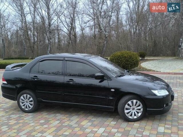 Чорний Міцубісі Lancer, об'ємом двигуна 1.58 л та пробігом 263 тис. км за 4500 $, фото 2 на Automoto.ua
