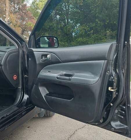 Черный Мицубиси Лансер, объемом двигателя 2 л и пробегом 225 тыс. км за 4400 $, фото 8 на Automoto.ua