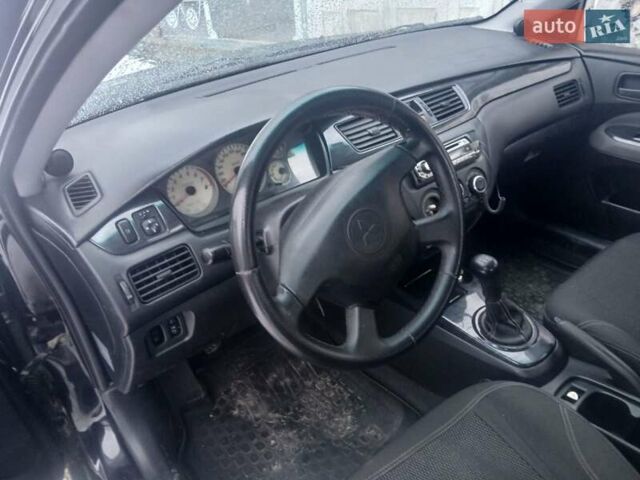Чорний Міцубісі Lancer, об'ємом двигуна 1.6 л та пробігом 275 тис. км за 2999 $, фото 9 на Automoto.ua