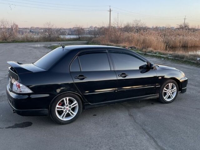 Черный Мицубиси Лансер, объемом двигателя 2 л и пробегом 50 тыс. км за 4500 $, фото 6 на Automoto.ua