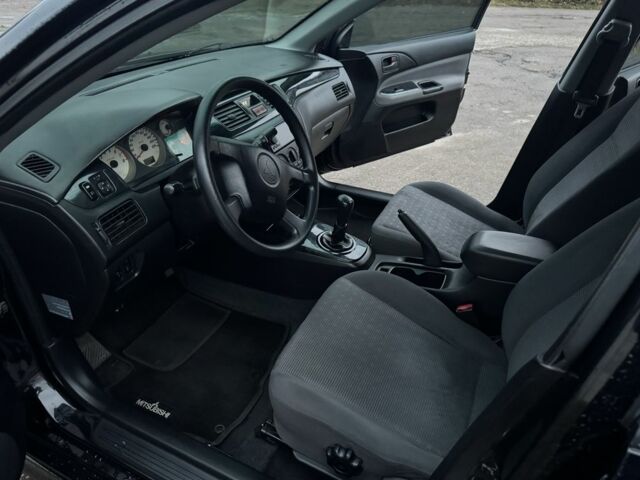 Чорний Міцубісі Lancer, об'ємом двигуна 1.6 л та пробігом 154 тис. км за 5500 $, фото 18 на Automoto.ua