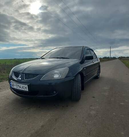 Черный Мицубиси Лансер, объемом двигателя 2 л и пробегом 225 тыс. км за 4400 $, фото 1 на Automoto.ua