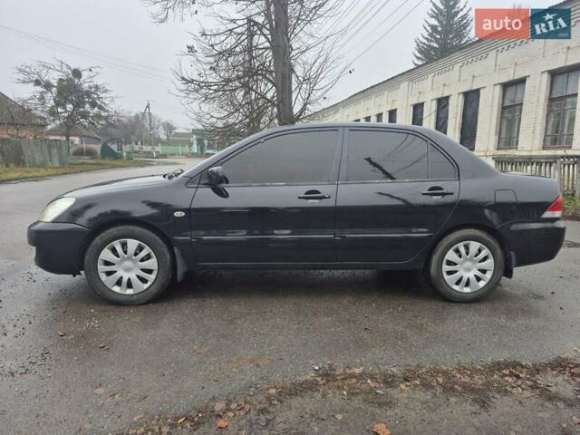 Черный Мицубиси Лансер, объемом двигателя 1.58 л и пробегом 280 тыс. км за 3200 $, фото 1 на Automoto.ua