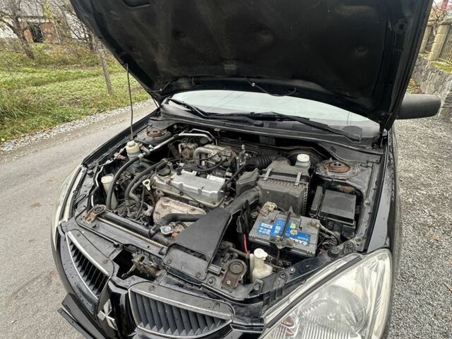 Черный Мицубиси Лансер, объемом двигателя 1.6 л и пробегом 200 тыс. км за 3500 $, фото 10 на Automoto.ua