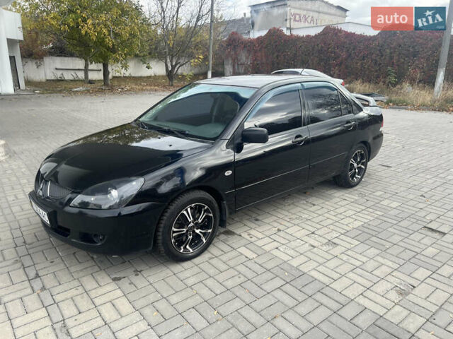 Чорний Міцубісі Lancer, об'ємом двигуна 1.58 л та пробігом 364 тис. км за 4000 $, фото 2 на Automoto.ua