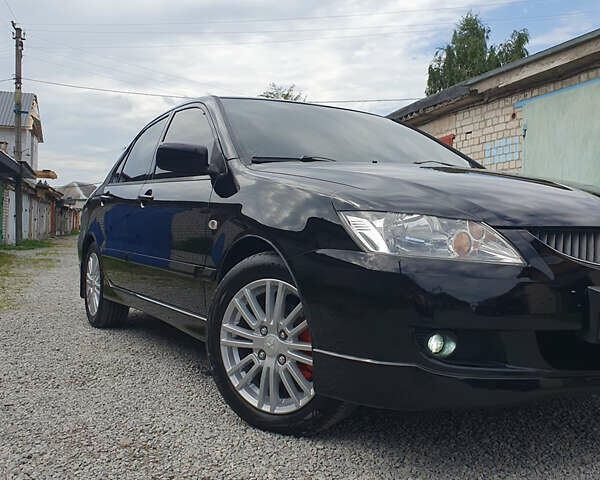 Черный Мицубиси Лансер, объемом двигателя 1.58 л и пробегом 154 тыс. км за 5500 $, фото 47 на Automoto.ua