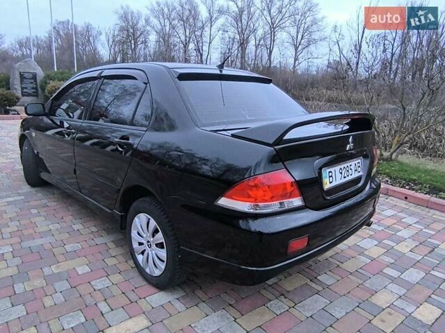 Чорний Міцубісі Lancer, об'ємом двигуна 1.58 л та пробігом 263 тис. км за 4500 $, фото 17 на Automoto.ua