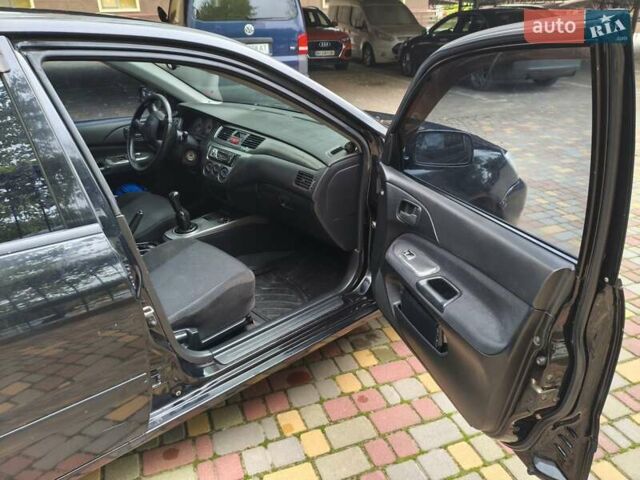 Мицубиси Лансер 2005 в Одессе на Automoto.ua Черный Мицубиси Лансер, объемом двигателя 1.58 л и пробегом 206 тыс. км за 3900 $, фото 12 на Automoto.ua
