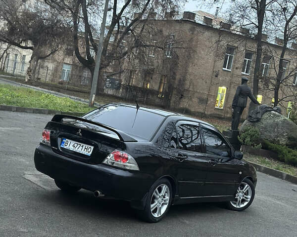 Черный Мицубиси Лансер, объемом двигателя 2 л и пробегом 250 тыс. км за 3700 $, фото 6 на Automoto.ua