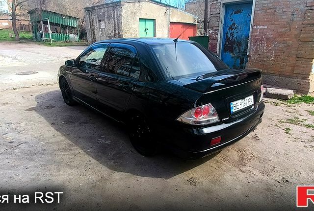 Чорний Міцубісі Lancer, об'ємом двигуна 2 л та пробігом 265 тис. км за 4000 $, фото 3 на Automoto.ua