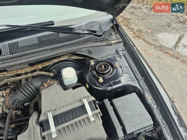 Черный Мицубиси Лансер, объемом двигателя 1.58 л и пробегом 280 тыс. км за 3200 $, фото 15 на Automoto.ua