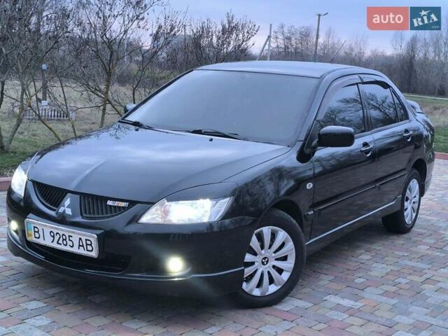 Чорний Міцубісі Lancer, об'ємом двигуна 1.58 л та пробігом 263 тис. км за 4500 $, фото 20 на Automoto.ua