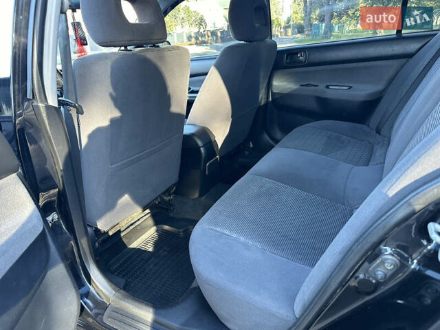 Мицубиси Лансер 2005 в Виннице на Automoto.ua Черный Мицубиси Лансер, объемом двигателя 1.6 л и пробегом 261 тыс. км за 4100 $, фото 41 на Automoto.ua