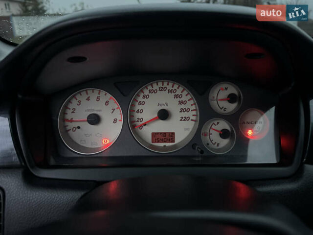 Черный Мицубиси Лансер, объемом двигателя 1.58 л и пробегом 154 тыс. км за 5500 $, фото 29 на Automoto.ua
