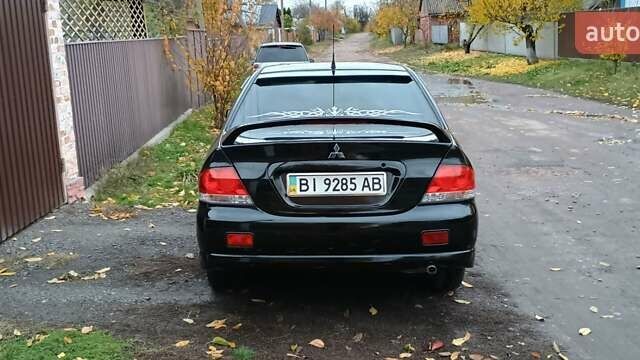 Черный Мицубиси Лансер, объемом двигателя 1.58 л и пробегом 261 тыс. км за 4400 $, фото 6 на Automoto.ua
