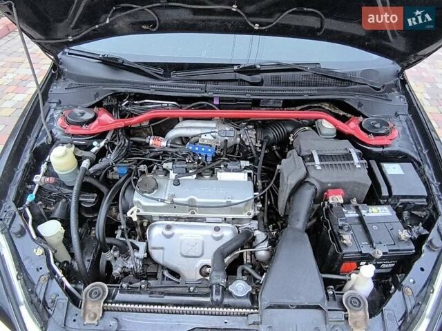 Чорний Міцубісі Lancer, об'ємом двигуна 1.58 л та пробігом 263 тис. км за 4500 $, фото 18 на Automoto.ua